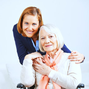 senior woman with her caregiver are smiling