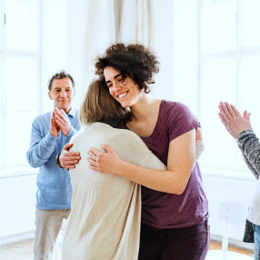 women hugging each other
