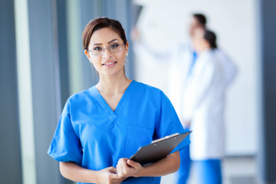 nurse wearing eyeglasses smiling
