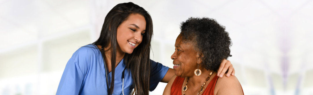 caregiver and senior woman looking at each other